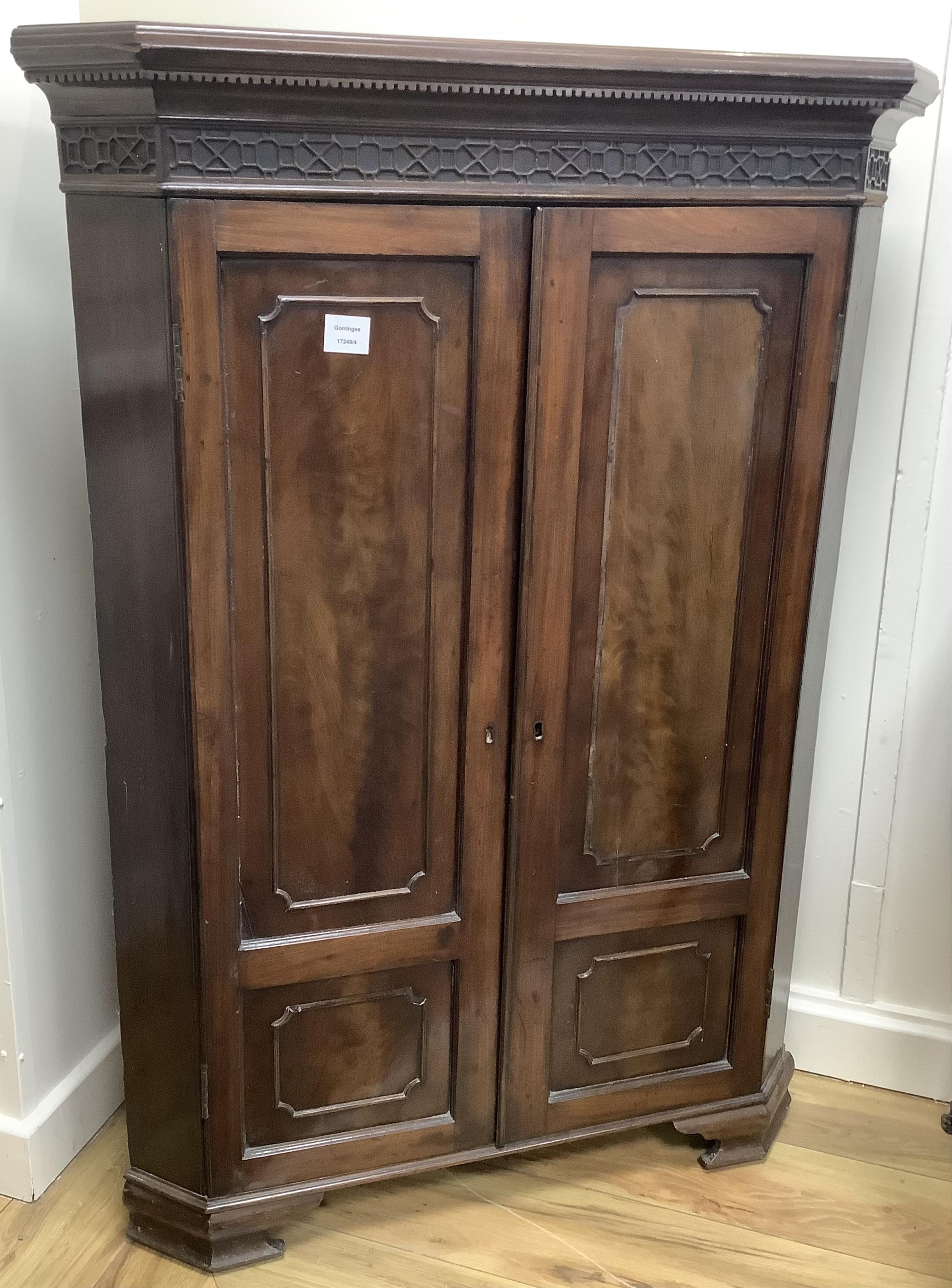 A George III and later mahogany corner cabinet, width 86cm, depth 45cm, height 123cm. Condition - fair, lacks some moulding to door